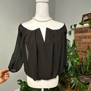 #8) Fashion Magazine Sexy shoulder off crop black top new condition.